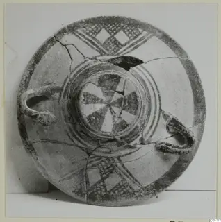 Pottery White Painted I bowl with dark bands, lattice and diamond motifs, and a central wedge pattern, seen from above.