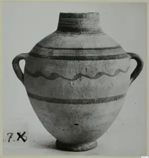 Pottery White Painted IV amphora from Amathus, two-handled, with dark painted bands and a wavy line