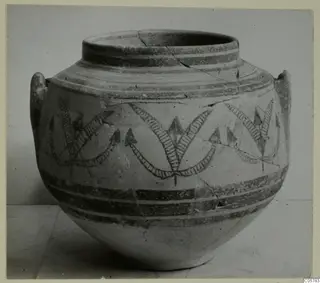 Painted pottery jar with two handles, dark bands and hatched wavy motifs around the body, from Amathus.