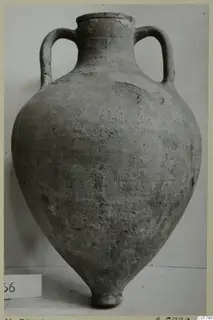 Pottery Plain White VI amphora from Marion, with two handles and a pointed base, photographed against a plain background.