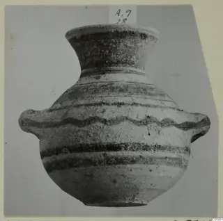 Painted pottery amphora-crater from Amathus with a flared neck and two side handles, photographed against a grey backdrop