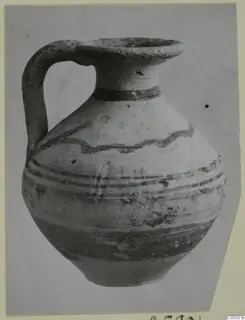 Pottery Bichrome IV jug from Marion, with a strap handle, flared mouth and painted bands