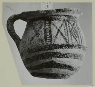 White Painted I jug from Amathus with dark banded and cross-hatched decoration, shown in a photograph