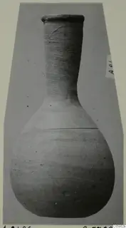 Unguentarium from Amathus tombs 10–26, a flask with a tall narrow neck and rounded body