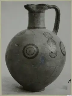 Round-bodied jug with black concentric circle motifs on its body, Pottery Black-on-Red II-IV