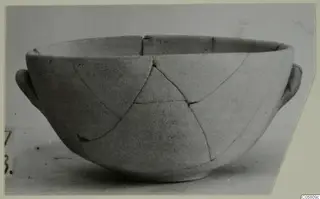 Plain White I-III bowl with two side handles, broken and mended.