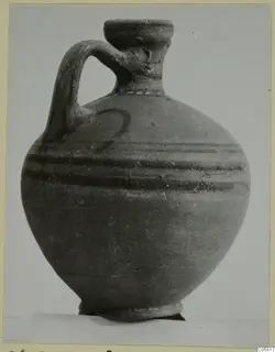 Pottery jug with a strap handle and two dark painted bands, from Marion