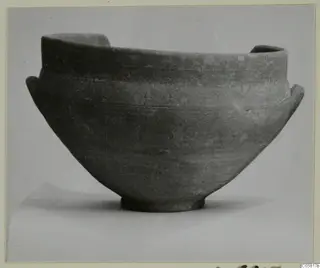 Red Slip bowl with two small side handles and a ring foot