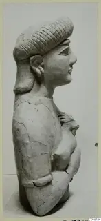 Terracotta Neo-Cypriote statue: a bust seen in profile, with incised diagonal pattern on the hair