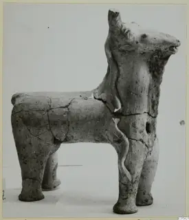 Terracotta figurine of a standing four-legged animal, from Ayia Irini, shown in side view