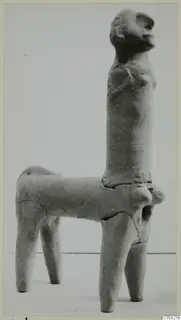 Terracotta figurine with a human-like head and upright torso on a four-legged body, from Ayia Irini