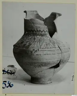 Pottery Bichrome IV, Amphora-Crater: a painted vessel with a broken neck, photographed against a pale background