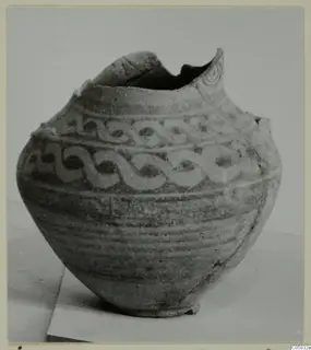 Pottery Bichrome IV amphora-crater (J.609) with a broken rim and bands of painted interlocking scroll decoration.