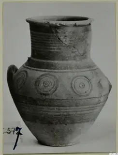 Pottery Bichrome V jar with a flared rim, banded body and concentric circle motifs