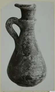 Grey Polished Ware jug with a single loop handle and flared rim, from Idalion