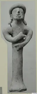 Terracotta figurine of a standing figure with arms folded across the chest, shown full length