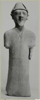 Standing terracotta figurine with a pointed cap and stub arms, from Ayia Irini