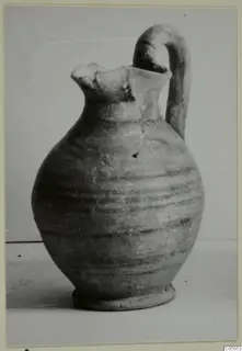 Pottery jug with a pinched mouth and tall loop handle, from Idalion.