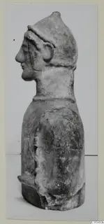 Terracotta figure of a helmeted man in profile facing left, from Mersinaki