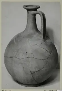 Globular jug with a tall neck and single strap handle, cracked and rejoined, from Idalion