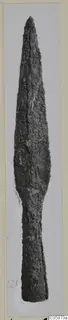 Corroded iron sword blade with a tapering tang, photographed upright on a mount card.