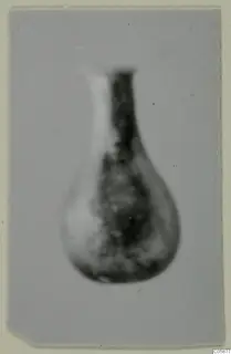 Blown glass vessel with a long narrow neck and rounded body, from Idalion