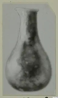 Blown glass vessel from Idalion with a flared rim, long narrow neck and rounded body