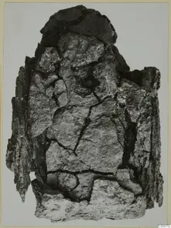 Heavily corroded iron axe from Idalion, with flaking crust and deep cracks
