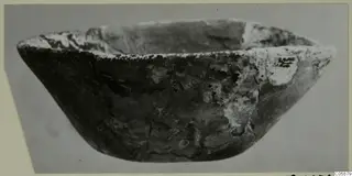 Bowl from Idalion, photographed from the side against a grey backdrop