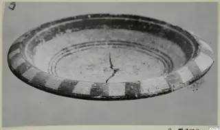 Pottery White Painted V bowl, shallow, with alternating dark and pale blocks around its outer wall