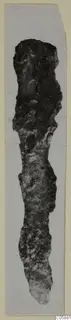 Corroded bronze knife from Idalion, photographed upright on a pale card mount