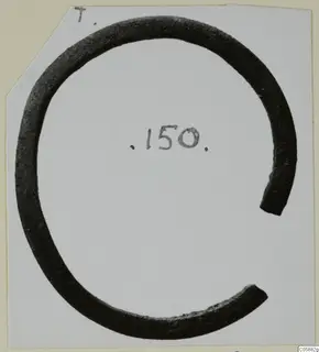 Open bracelet of dark metal with a wide gap, photographed on a white card