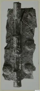 Corroded bronze hinge with a long vertical pin running through its flat plate