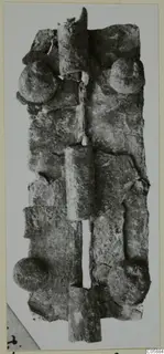 Corroded bronze mounting with tubular sections and round domed studs, from Idalion