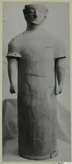 Terracotta statue of a standing figure with a cylindrical body, short arms and a rounded head
