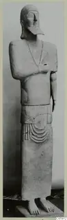 Terracotta Neo-Cypriote statue from Ayia Irini, standing with arms crossed over the chest