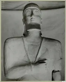 Terracotta statue from Ayia Irini, head and upper body with incised bands across the chest