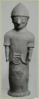Terracotta Proto-Cypriote I: standing figure with a pointed cap and short sleeves, on a flat base