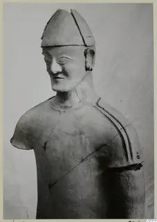 Terracotta statue, upper body of a figure in a tall cap, from Ayia Irini.