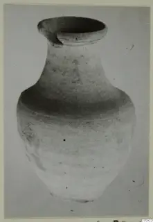 Pottery Plain White IV-V vessel with a wide mouth and pinched spout, photographed against a plain background.
