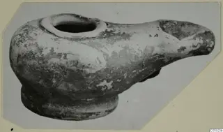 Terracotta lamp from Idalion with a round filling hole and a long nozzle