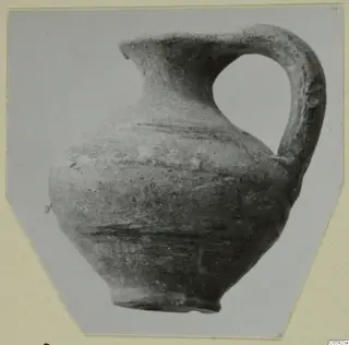 Pottery jug with a pinched spout and a tall loop handle, from Idalion