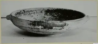 Shallow Black-on-Red pottery bowl with two small lugs, seen from the side