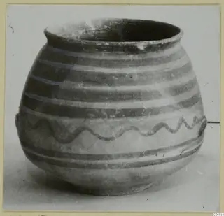 Bichrome-Red jar with horizontal painted bands and a wavy painted line on its body