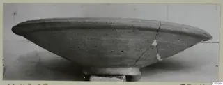 Pottery Plain White VII bowl in side profile, with a wide flaring rim and a cracked, repaired side
