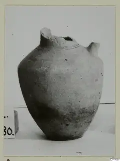 Jug of Plain White I-III pottery from Idalion, with a broken tall neck and a small spout on the right shoulder