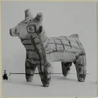 Terracotta figurine of a four-legged animal with dark painted bands, from Idalion
