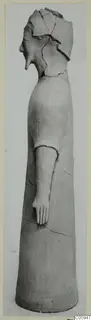 Terracotta figure of a standing human figure, broken at the head, with one arm extended forward.