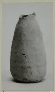 Pottery Plain White IV-V vessel with a narrow mouth, tapering body and rounded base