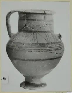 Pottery Black-on-Red jug with a single handle, dark painted bands and fanned lines on the shoulder